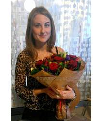 Girl with a bouquet of roses and Aust Send flowers to Brovary