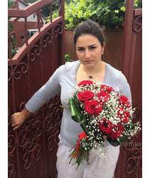 The bouquet of red roses for a beautiful girl