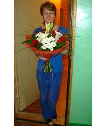 The delivery of a bouquet of lilies, roses and chrysanthemums