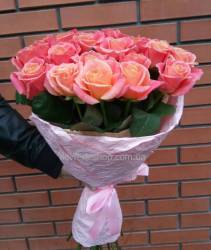 Bright coral roses in the package A bouquet of roses was delivered to Khmelnitsky