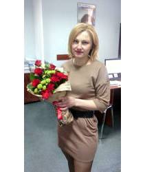 Delivered in Borispol elongated bouquet in red and green scheme