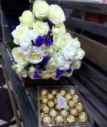 Flowers made in Herson Bouquet of heart shaped roses and chocolates delivered to Herson